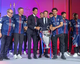 Nasser al-Khelaifi and Marquinhos lift the Champions League trophy