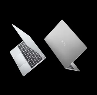 <em>The new XPS 13 in its silver and gray colors, which Dell calls “sky” and “storm.”</em>