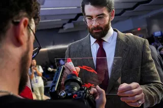 Streamer Hasan Piker signs a panel in front of a camera lens during a campaign event for Abdul El-Sayed, a progressive candidate in the Democratic primary for U.S. Senate in Michigan, Tuesday, April 7, 2026, at the University of Michigan in Ann Arbor, Mich. (AP Photo/Julia Demaree Nikhinson)