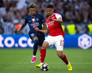William Sabila battles with French teammate Desiré Doué during the Champions League final.