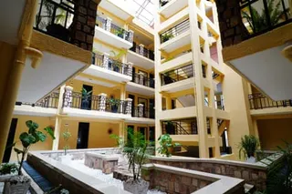 Internal balconies and walkways and a courtyard in a hostel building