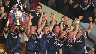 Sheffield Eagles captain Paul Broadbent lifts the trophy aloft after the 1998 Challenge Cup final against Wigan Warriors