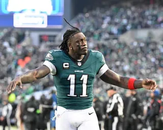 AJ Brown reacts with his hands up during an Eagles game.