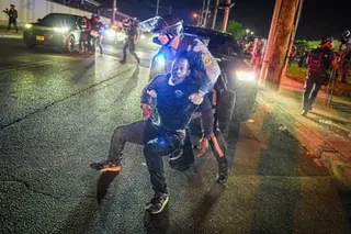 a police officer grabs a mn