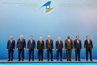 From left: Armenian Deputy Prime Minister Mher Grigoryan, Belarusian President Alexander Lukashenko, Kyrgyz President Sadyr Japarov, Russian President Vladimir Putin, Kazakh President Kassym-Jomart Tokayev, Uzbek President Shavkat Mirziyoyev, Cuban Vice President Salvador Valdes Mesa, Iranian Minister of Industry, Mines, and Trade Seyed Mohammad Atabak and Chairman of the Board of the Eurasian Economic Commission Bakytzhan Sagintaev pose for a photo before an expanded format meeting of the Supre