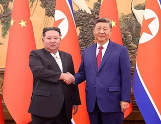 去年9月北韓領袖金正恩（左）訪中，中國國家主席習近平（右）在北京人民大會堂接待。...