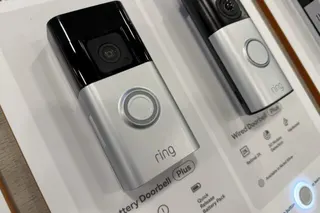 Ring devices that include a doorbell and camera on display inside a store.