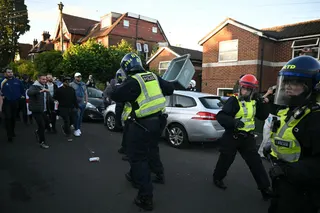 Police officers are attacked by demonstrators near Portswood Police Station, following a protest march in Southampton, southern England, on June 2, 2026.