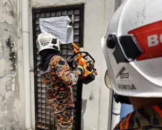 Perak Fire and Rescue Department assistant director of operations Sabarodzi Nor Ahmad said a team from the Ipoh Fire and Rescue Station arrived at the scene six minutes later and found the building’s entrance secured with a locked metal grille. — Picture from Facebook/Bomba Perak Official