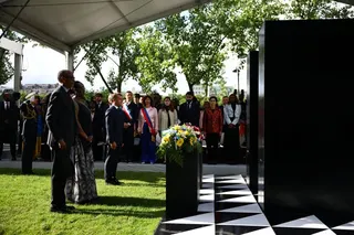(From L) Rwanda's President Paul Kagame, Rwanda's First Lady Jeannette Kagame and France's President Emmanuel Macron stand after laying wreaths of flowers on a monument for honouring the victims of the Rwanda's genocide made by the Portuguese artist Grada Kilomba, during a ceremony on the Habib-Bourguiba Esplanade along the Seine River in Paris, on June 2, 2026. (Photo by Sarah Meyssonnier / POOL / AFP) / RESTRICTED TO EDITORIAL USE - MANDATORY MENTION OF THE ARTIST UPON PUBLICATION - TO ILLUSTR