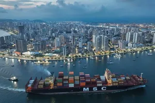 a container ship approaches a port