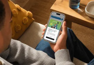 person looking at Everand app on smartphone