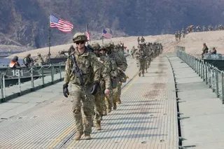 FILE - U.S. Army soldiers cross a floating bridge on the Imjin River during a joint river-crossing exercise between South Korea and the United States as a part of the Freedom Shield military exercise in Yeoncheon, South Korea, March 20, 2025. (AP Photo/Ahn Young-joon, File)