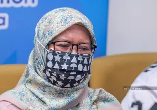 Ayu speaking at a press conference regarding her appeal after her son was deceived and forced into labour by a scam syndicate in Myanmar. NSTP/HAZREEN MOHAMAD