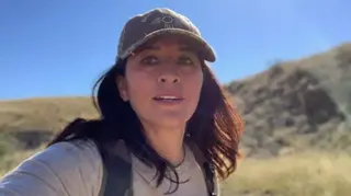 Find Melissa Mondragon Casias/Facebook A selfie of Melissa Casias. She has long brunette hair and is wearing a baseball cap and a backpack.