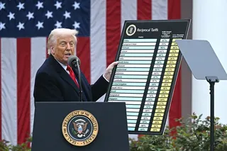 US President Donald Trump holds a chart as he delivers remarks on tariffs at the White House in April 2025. Photo: TNS