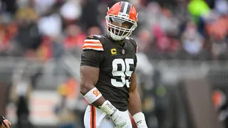 Myles Garrett standing on the field during an NFL game in Cleveland