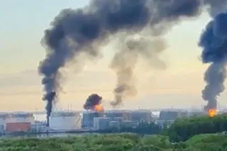 Smoke billows following hits by Ukrainian drones at an oil terminal in St Petersburg, Russia, on Wednesday. Photo: Social media via Reuters