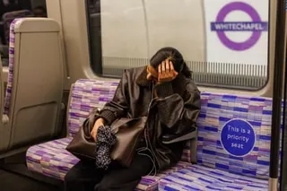 A tired commuter on the Elizabeth line