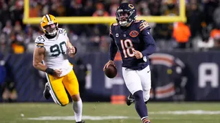 Chicago Bears' Caleb Williams running with football away from Green Bay Packers' Lukas van Ness