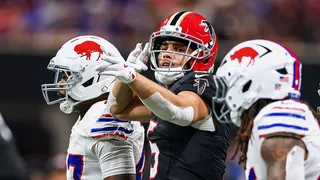 Drake London of the Atlanta Falcons celebrating after a catch at Mercedes-Benz Stadium