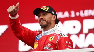 Lewis Hamilton gives a thumbs up on the podium in Canada