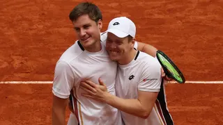 Harri Heliovaara of Finland and Henry Patten of Great Britain celebrate winning match point against Quentin Halys and Pierre-Hugues Herbert of France