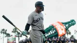 Aaron Judge walking to dugout after striking out during baseball game