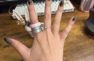 <em>An Oura Ring 5 sandwiched between two Oura Ring 4s. </em>