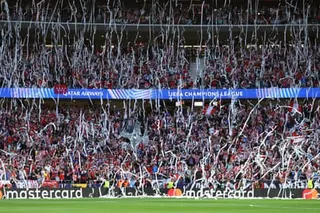 Atlético Madrid fans throw toilet paper before the Champions League semi-final first leg with Arsenal.