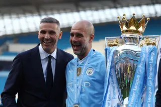 Manchester City manager Pep Guardiola celebrates with chairman Khaldoon Al Mubarak and the trophy after winning the Premier League in 2024