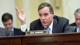 Sen. Mark Warner speaking at a Senate hearing in Washington