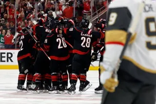Carolina Hurricanes players celebrate after the winning goal by Seth Jarvis in Game 2 of the Stanley Cup final.