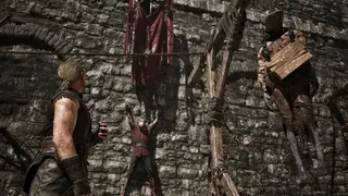 A pair of executed traitors hang by a wall in the Old Camp