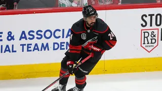 Seth Jarvis of the Carolina Hurricanes looks to pass during NHL Stanley Cup Final game.