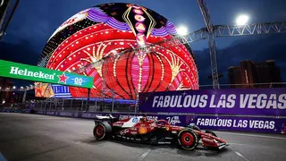 Charles Leclerc drives past the Sphere on the track in Las Vegas
