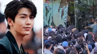 A composite image of Zhang Linghe and the shattering glass with a crowd