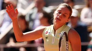 Maja Chwalinska reacts in the French Open final by throwing her right arm into the air