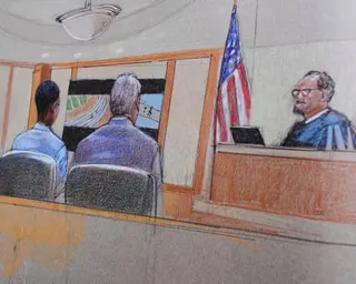 A sketch shows people sitting in court in front of a judge and a US flag