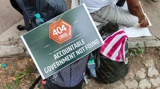 A poster at the protest in Delhi that reads “Accountable Government Not Found”, with the common “404 Error” symbol that represents a broken link online.