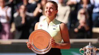 Maja Chwalinska smiles while holding the French Open women's singles runner-up trophy
