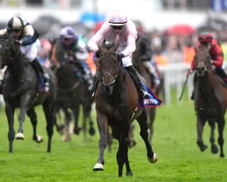 Christmas Day, ridden by Ronan Whelan, on their way to winning the Betfred Derby at Epsom.