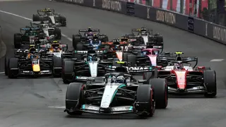 Kimi Antonelli leads the field into the first corner as the Monaco Grand Prix restarts after a red flag