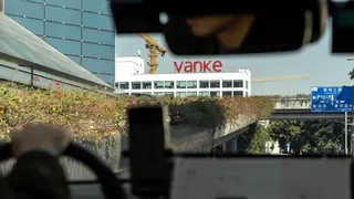 Signage for China Vanke Co. atop a building in Shenzhen, China, on Wednesday, Jan. 14, 2026.