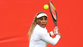 Serena Williams hits a return during practice at Queen's