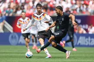 Miles Robinson of United States makes a pass as Germany’s Kai Havertz defends on Saturday in Chicago.
