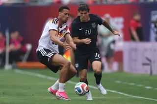 Felix Nmecha of Germany and Christian Pulisic of United States compete for the ball during Saturday’s friendly.a
