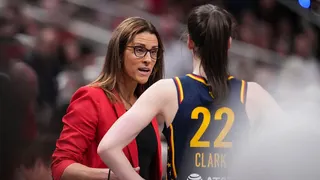 Indiana Fever guard Caitlin Clark talks to head coach Stephanie White at Gainbridge Fieldhouse