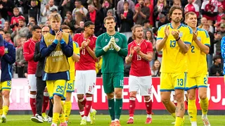 Denmark and Ukraine players applaud fans after their friendly in June 2026 is abandoned