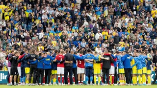 Denmark and Ukraine players in a huddle after their friendly in June 2026 is abandoned